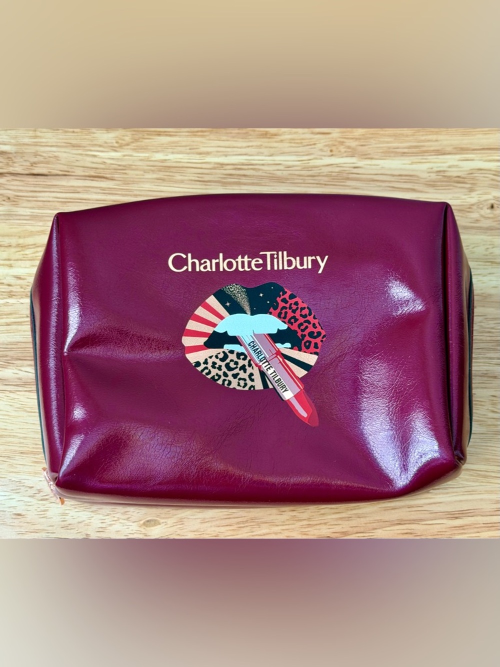 Charlotte Tilbury Burgundy Cosmetic Pouch with Lip Graphic